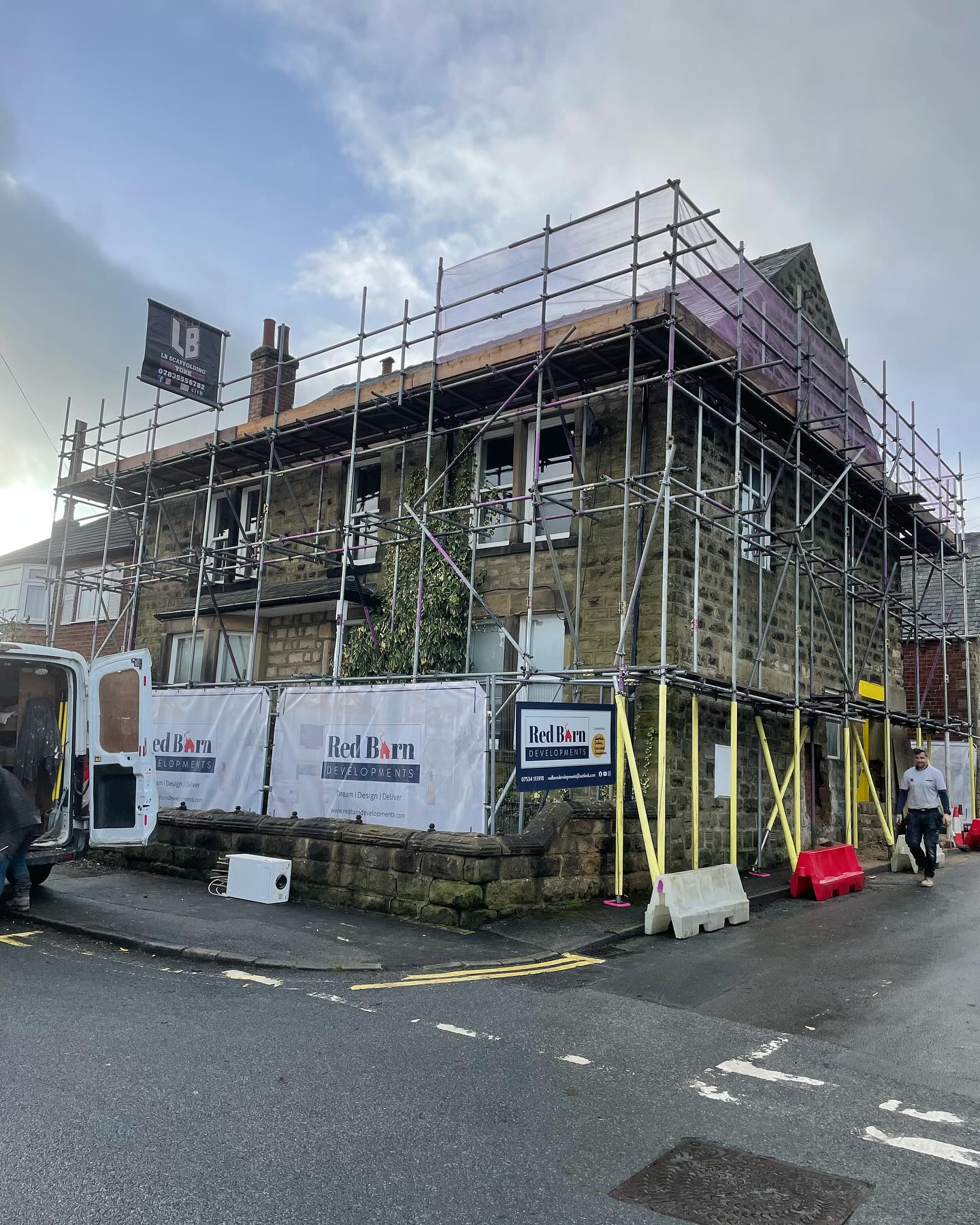 Yorkshire stone semi-detached home with corner scaffolding wrap