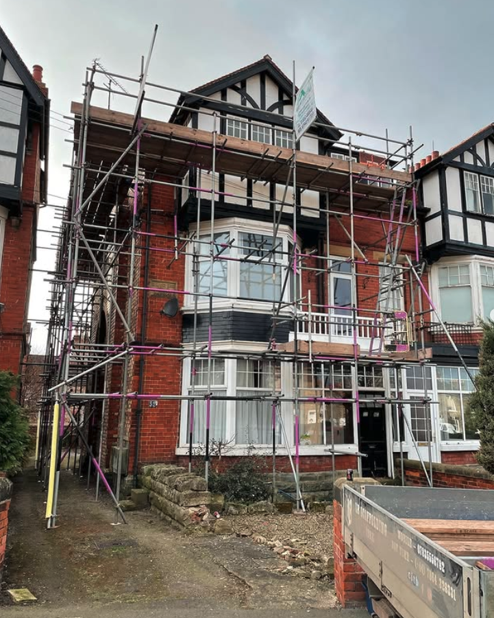 Edwardian villa with scaffolding around bay window and roof line